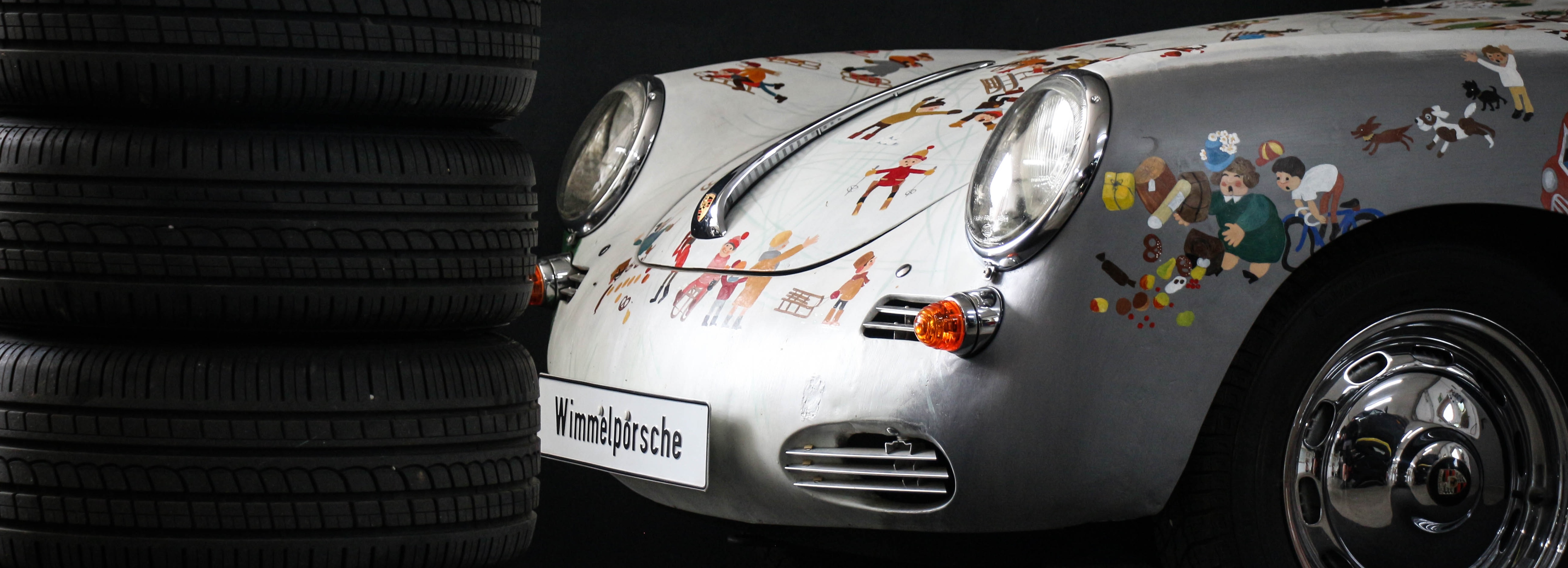 Wimmelporsche in Nahaufnahme mit Reifenstapel in der Werkstatt von MasterTec